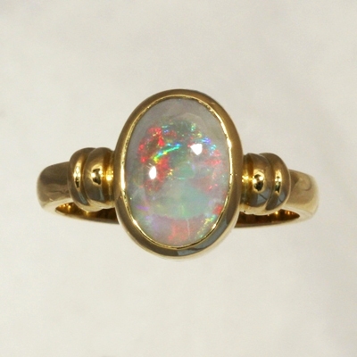 CUSTOM MADE 18k Yellow Gold Ring with a SOLID SEMI BLACK OPAL Rolling flashes of red to blue to green 